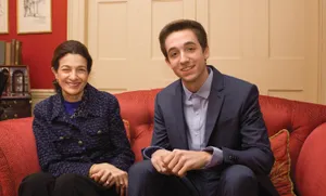 Olympia Snowe Relaxing On A Sofa Wallpaper