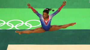 Olympian Simone Biles Airborne Wallpaper