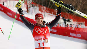 Olympic Skier Celebrating Victory Beijing2022 Wallpaper