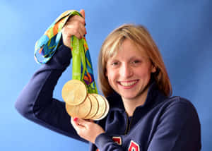 Olympic Swimmerwith Gold Medals Wallpaper