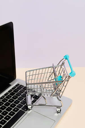 Online Shopping Conceptwith Cartand Laptop Wallpaper