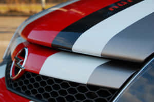 Opel Astra Driving On A Picturesque Road Wallpaper