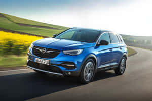 Opel Grandland X Suv - Modern City Driving Meets Outdoor Adventure Wallpaper