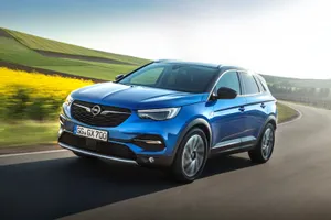 Opel Grandland X Suv - Modern City Driving Meets Outdoor Adventure Wallpaper