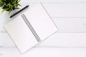 Open Notebookwith Penand Plant Wallpaper