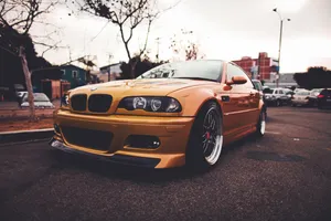 Orange B M W E46 M3 Coupe Urban Backdrop Wallpaper
