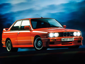 Orange Bmw M3 Car Headlights On Wallpaper