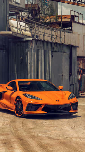 Orange Corvette C8 Industrial Backdrop.jpg Wallpaper