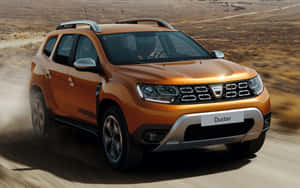 Orange Dacia Duster Off Road Action Wallpaper