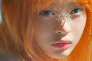 Orange Haired Personwith Crystal Accessory Wallpaper