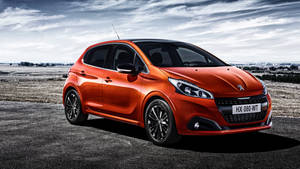 Orange Peugeot 208 Model Wallpaper