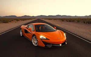 Orange Sports Car Desert Road Wallpaper