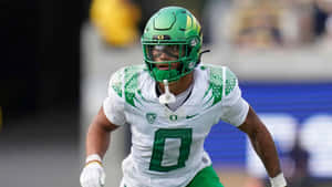 Oregon Football Playerin Action Wallpaper