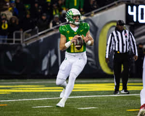 Oregon Quarterback Bo Nix Action Shot Wallpaper