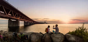 Oresund Bridge Romantic Couple Sunset Wallpaper