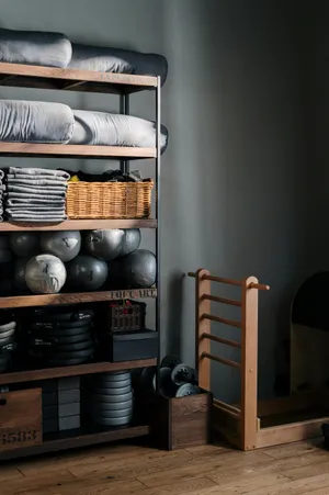 Organized Home Gym Equipment Shelving Wallpaper