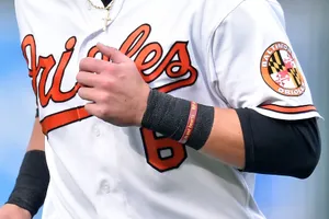 Orioles Player Adjusting Jersey Wallpaper