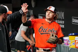 Orioles Player High Five Celebration Wallpaper