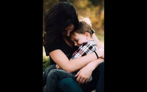Ornery Kid With His Mother Wallpaper