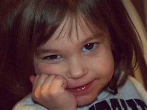 Ornery Little Girl Holding Face Wallpaper