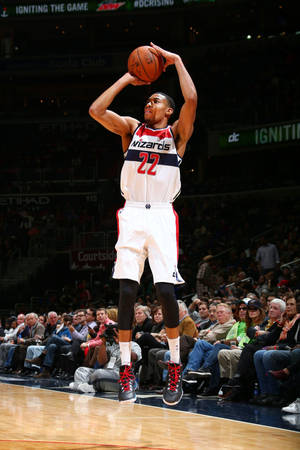 Otto Porter Jr. Concentrating On A Three-pointer Shot Wallpaper