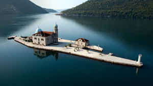 Our Lady Of The Rocks Surrounded By Water Wallpaper