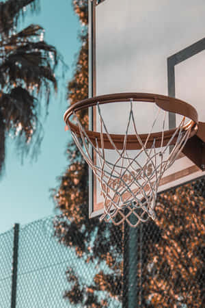 Outdoor Basketball Hoop Sunset Aesthetic.jpg Wallpaper