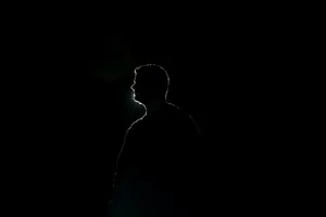 Outline Of A Man Profile On Black Backdrop Wallpaper