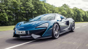 Outstanding Mclaren 570gt In Vibrant Emerald Green Wallpaper