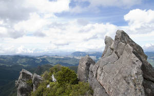 Overlooking Rock On The Mountain Wallpaper