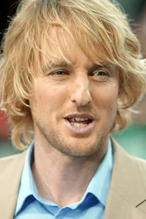 Owen Wilson In A Yellow T-shirt Wallpaper