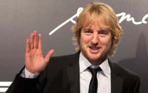 Owen Wilson Looking Dapper In A Navy Blue Suit Wallpaper