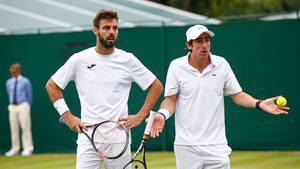 Pablo Cuevas Looking Confused With Marcel Granollers Wallpaper