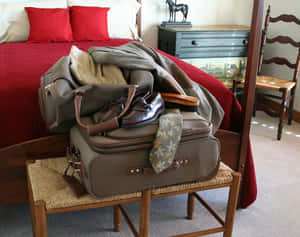 Packed Suitcase Readyfor Trip Wallpaper