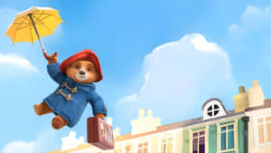 Paddington Bear Flying With Umbrella Wallpaper