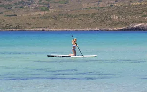 Paddleboarder Enjoying The Turquoise Ocean Wallpaper