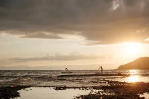 Paddleboarder On A Serene Lake Wallpaper