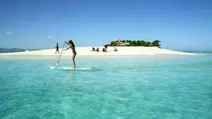Paddleboarding On A Beautiful Sunny Day Wallpaper
