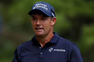 Padraig Harrington, Golf Professional In A Blue Cap And Uniform Wallpaper