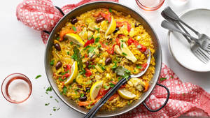 Paella Rice Dish On A Large Pan Wallpaper