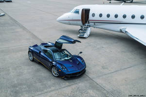 Pagani Huayra And White Airplane Wallpaper