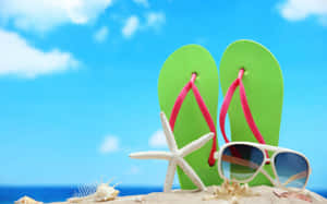 Pair Of Bright Beach Sandals On Sandy Shore Wallpaper