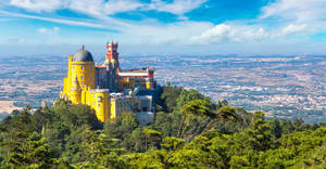 Palácio Da Pena Under The Beautiful Blue Sky In Sintra, Portugal Wallpaper