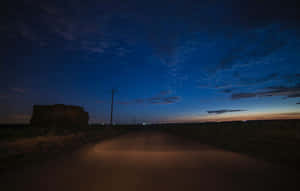 Palpable Calm On The Road At Night Wallpaper