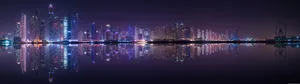 Panoramic Nighttime Cityscape Reflection Wallpaper