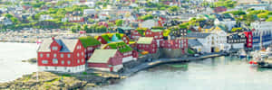 Panoramic View Of Thorshavn At Sunrise Wallpaper
