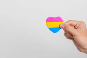 Pansexual Pride Heartin Hand Wallpaper