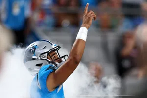 Panthers Quarterback Pointing Upward Wallpaper