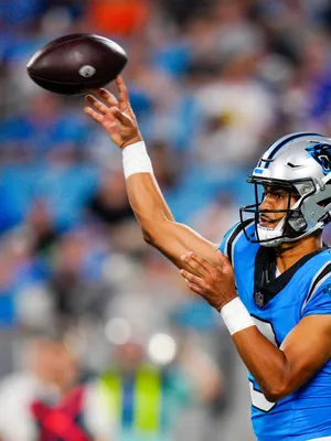 Panthers Quarterback Throwing Football Wallpaper