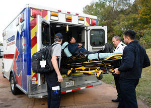Paramedic Boarding A Patient Wallpaper